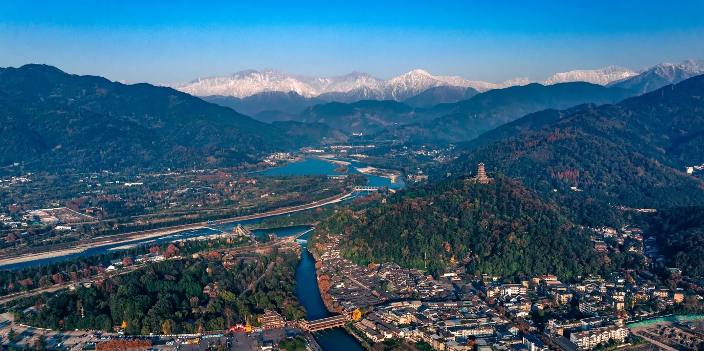 Historic Dujiangyan Irrigation System surrounded by green mountains