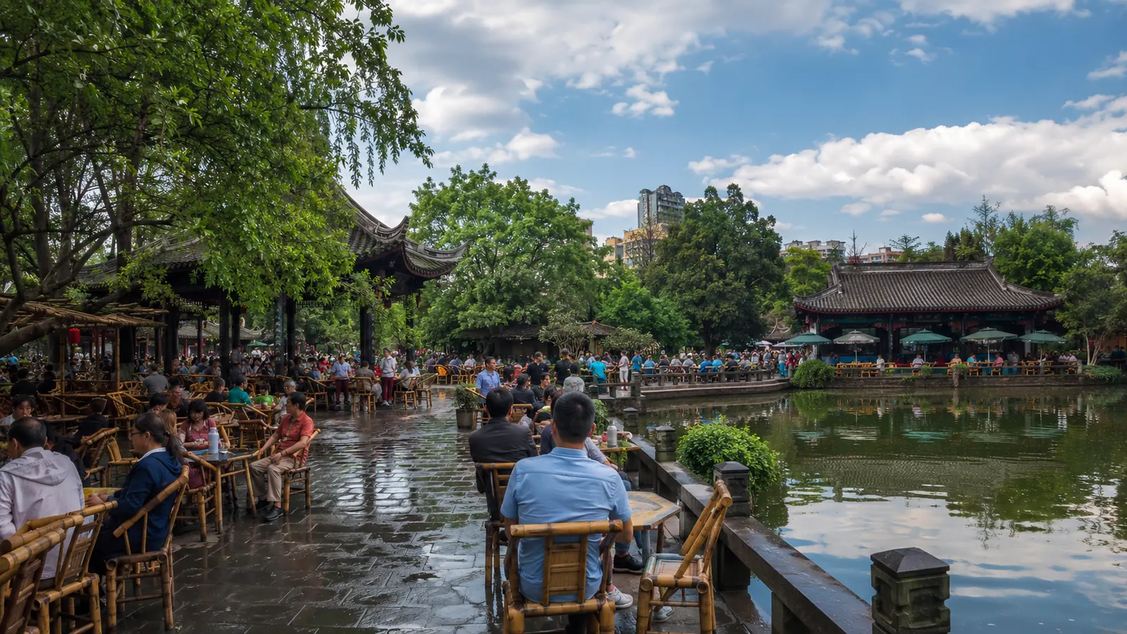People relaxing near a traditional teahouse in Chengdu